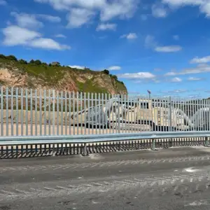 PALISADE FENCING WITH ARMCO BARRIER: Click Here To View Larger Image